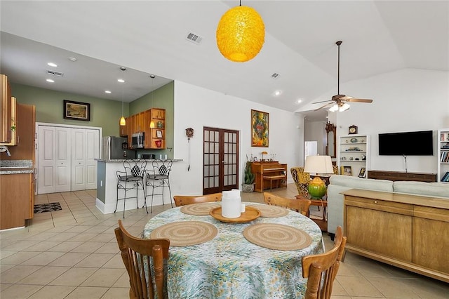 dining space featuring french doors, high vaulted ceiling, ceiling fan, and light tile floors