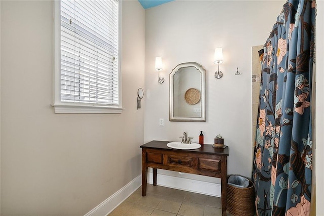 bathroom with tile flooring and vanity