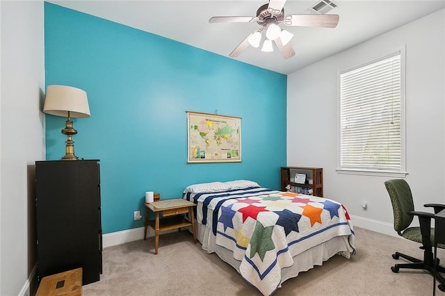 carpeted bedroom with ceiling fan