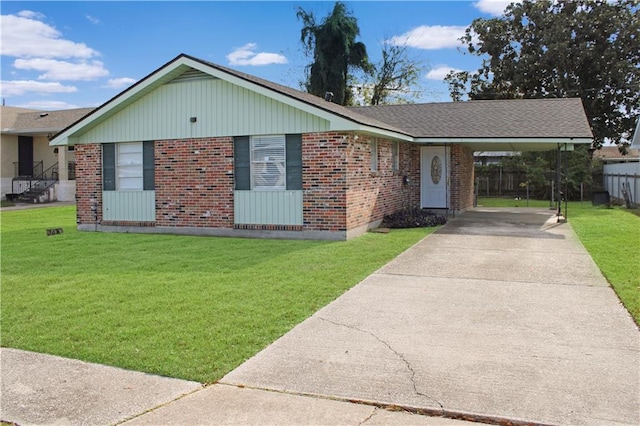 single story home featuring a carport and a front lawn