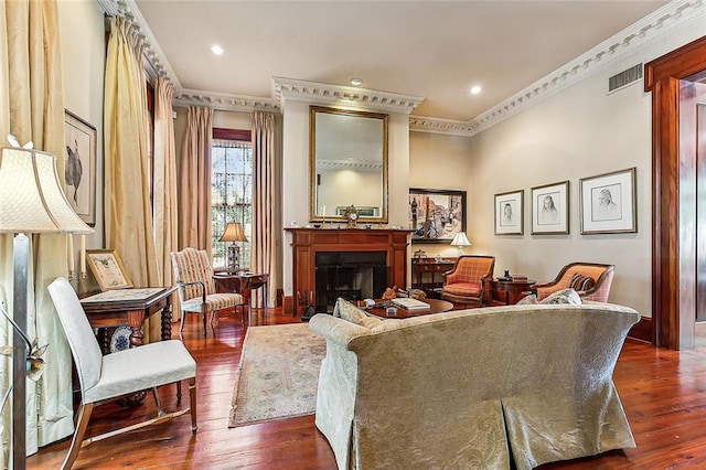 living room with crown molding and dark hardwood / wood-style flooring