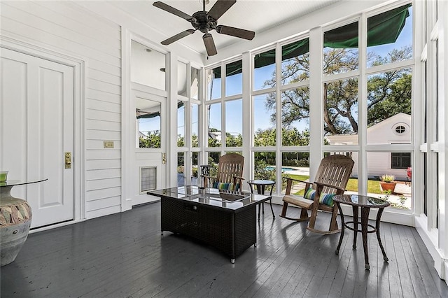 sunroom / solarium with ceiling fan and a healthy amount of sunlight