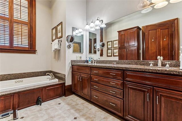 bathroom featuring tile floors, dual vanity, and a tub