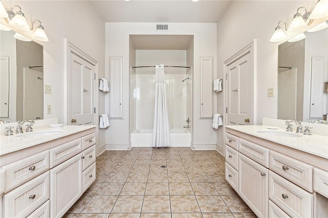 bathroom with large vanity, tile floors, double sink, and shower / tub combo with curtain