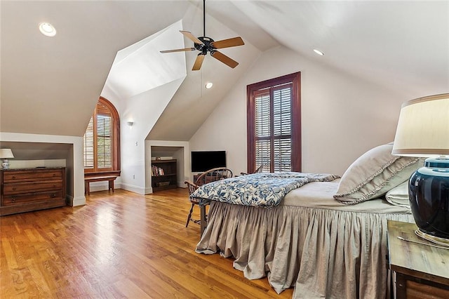 bedroom with light wood-type flooring, ceiling fan, and lofted ceiling