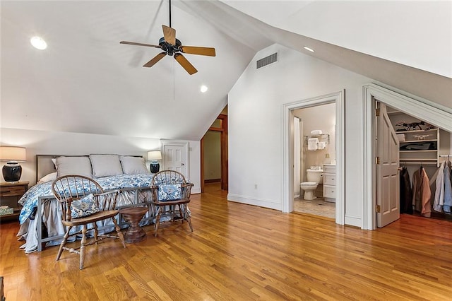 bedroom featuring ceiling fan, vaulted ceiling, and light wood-type flooring