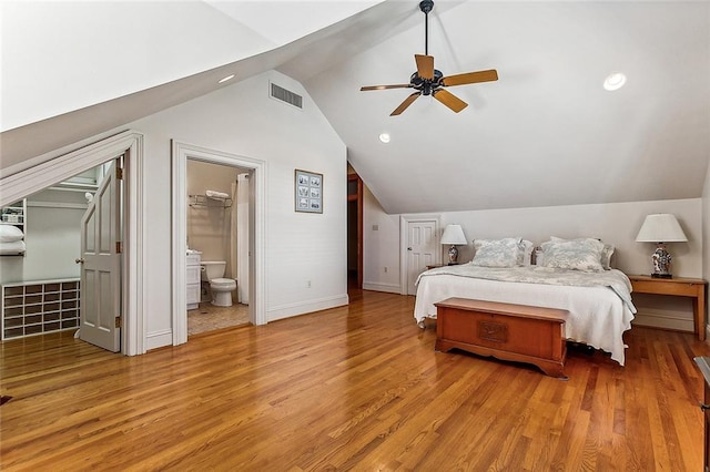 bedroom featuring lofted ceiling and light hardwood / wood-style floors