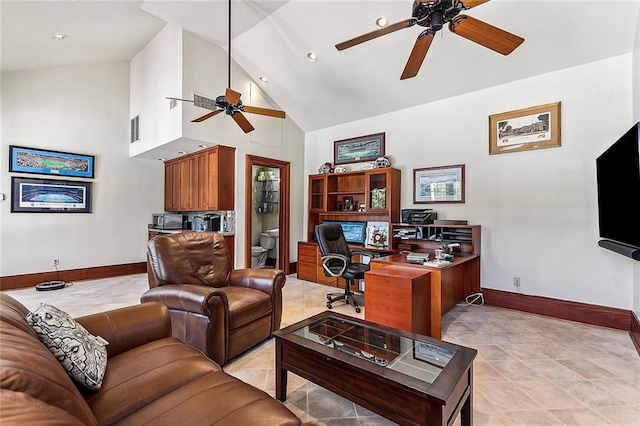 interior space featuring high vaulted ceiling, ceiling fan, and light tile floors