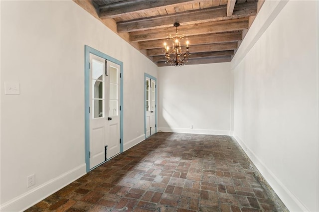 interior space with beamed ceiling, a chandelier, and wood ceiling