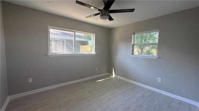 unfurnished room featuring light hardwood / wood-style floors, plenty of natural light, and ceiling fan