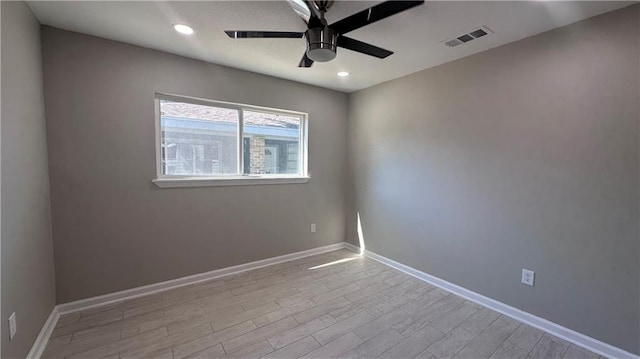 unfurnished room with ceiling fan and light wood-type flooring