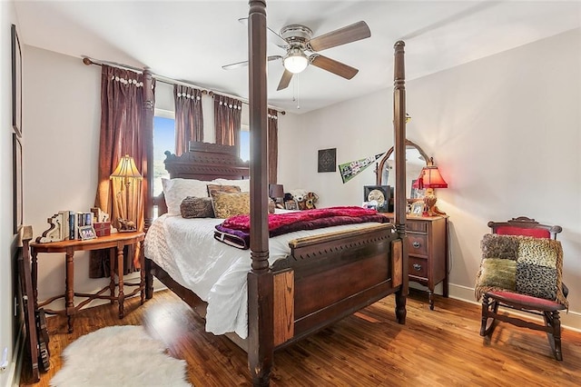 bedroom featuring dark hardwood / wood-style floors and ceiling fan