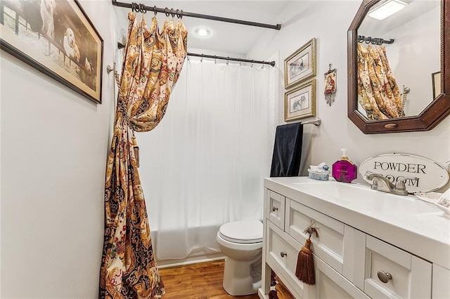 full bathroom with shower / tub combo with curtain, hardwood / wood-style floors, toilet, and oversized vanity