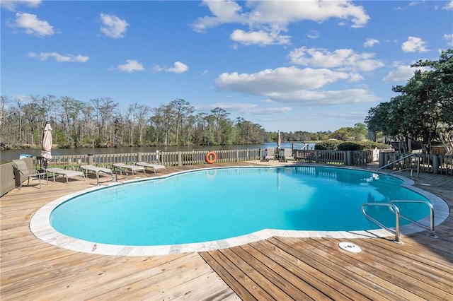 view of swimming pool with a deck