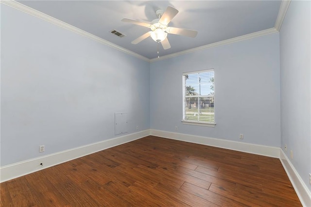 empty room with visible vents, baseboards, ornamental molding, wood finished floors, and a ceiling fan