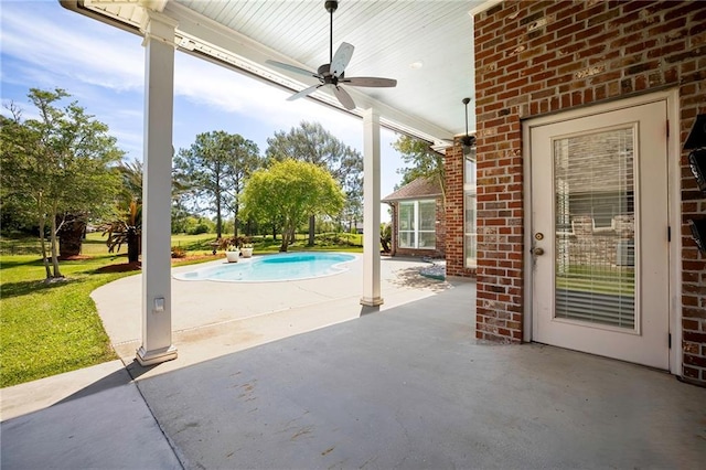 view of patio / terrace featuring an outdoor pool and a ceiling fan