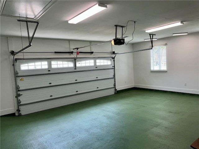 garage featuring baseboards and a garage door opener