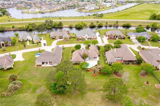 drone / aerial view with a residential view and a water view