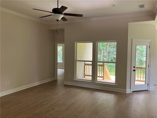 spare room featuring crown molding, ceiling fan, and dark hardwood / wood-style flooring