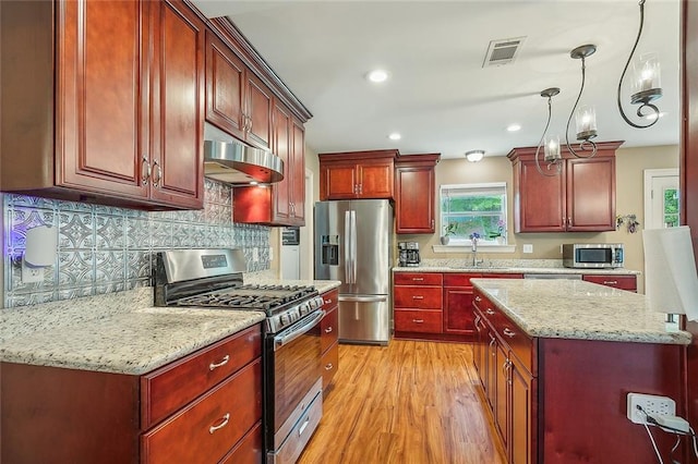 bathroom with dual sinks, oversized vanity, hardwood / wood-style floors, and shower / tub combo with curtain