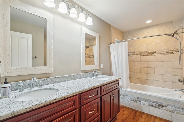 empty room with ceiling fan and hardwood / wood-style floors