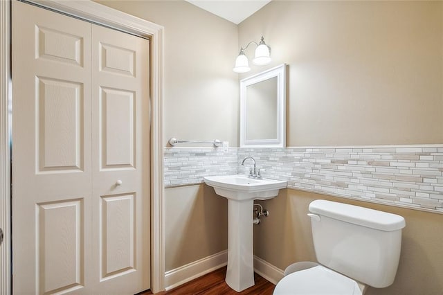 full bathroom featuring shower / tub combination, vanity, hardwood / wood-style flooring, and toilet