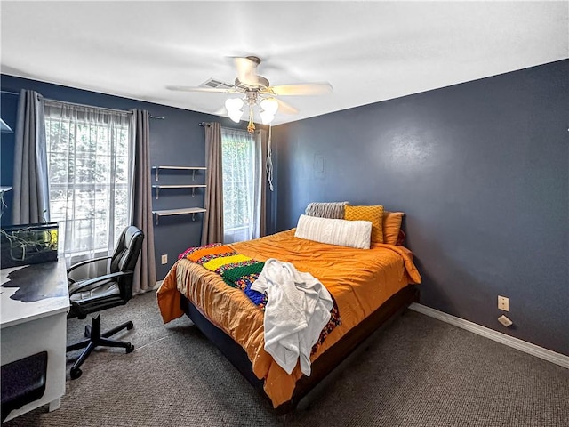 bedroom featuring dark carpet and ceiling fan