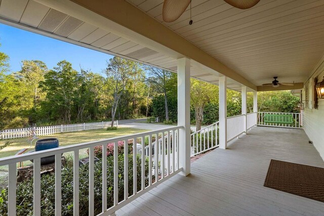 wooden deck with ceiling fan