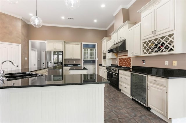 kitchen featuring white cabinetry, sink, beverage cooler, range with two ovens, and stainless steel refrigerator with ice dispenser