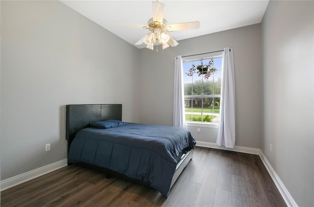bedroom featuring dark hardwood / wood-style flooring and ceiling fan