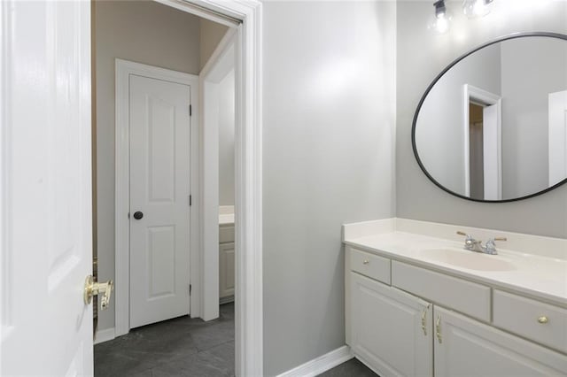 bathroom featuring tile flooring and vanity with extensive cabinet space