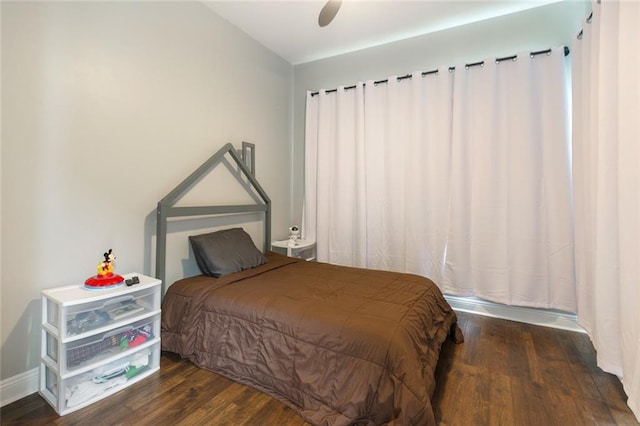 bedroom featuring dark hardwood / wood-style flooring and ceiling fan