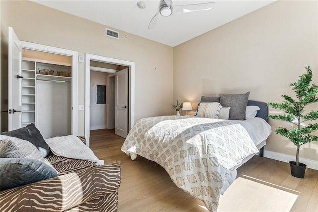 bedroom with a closet, ceiling fan, and light wood-type flooring