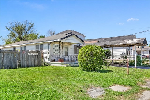 view of front of house with a porch and a front yard