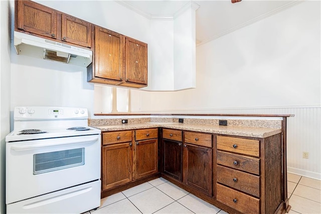 kitchen with white electric range oven, crown molding, light tile patterned floors, and wood walls