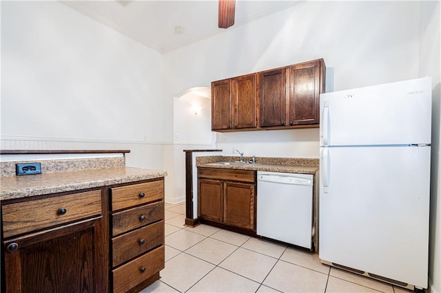 kitchen with ceiling fan, light tile patterned floors, crown molding, sink, and white appliances