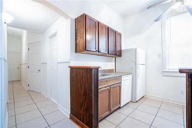 kitchen with dishwasher, light tile patterned floors, and ceiling fan