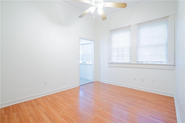 unfurnished room featuring crown molding, light wood-type flooring, and ceiling fan