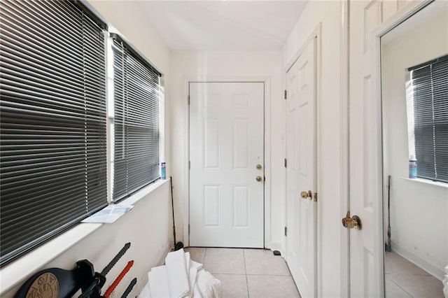 entryway featuring light tile patterned floors