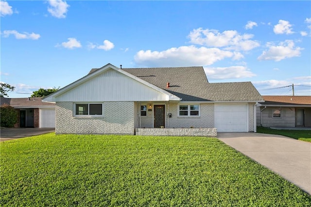 ranch-style home with a garage and a front lawn