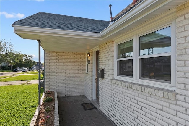 view of side of property with a lawn