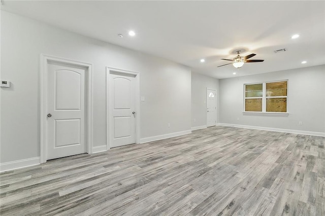 unfurnished room featuring ceiling fan and light wood-type flooring