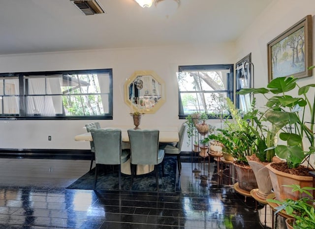 dining space featuring dark hardwood / wood-style flooring