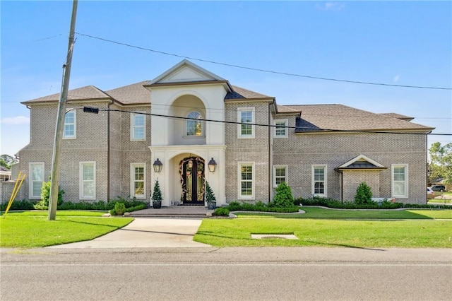 view of front of home with a front lawn