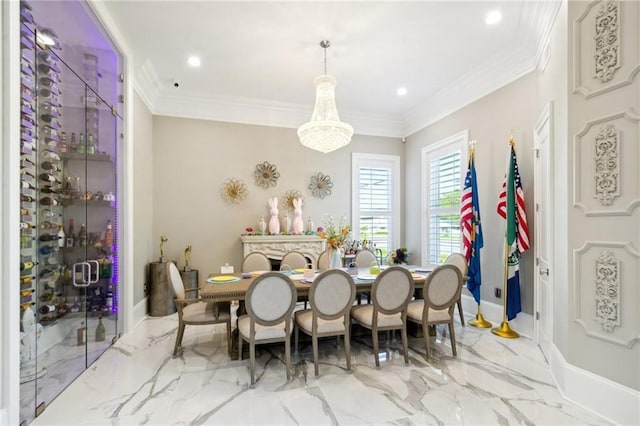 dining area featuring ornamental molding and an inviting chandelier