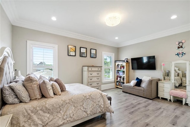 bedroom with light wood-type flooring, multiple windows, and ornamental molding