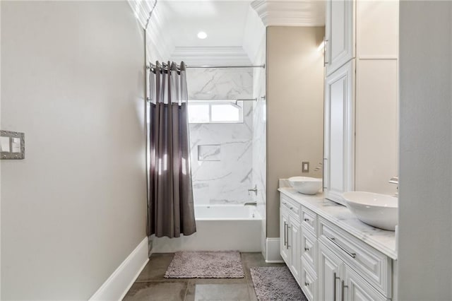 bathroom with vanity, tiled shower / bath combo, and crown molding