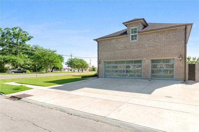 view of side of property with a garage