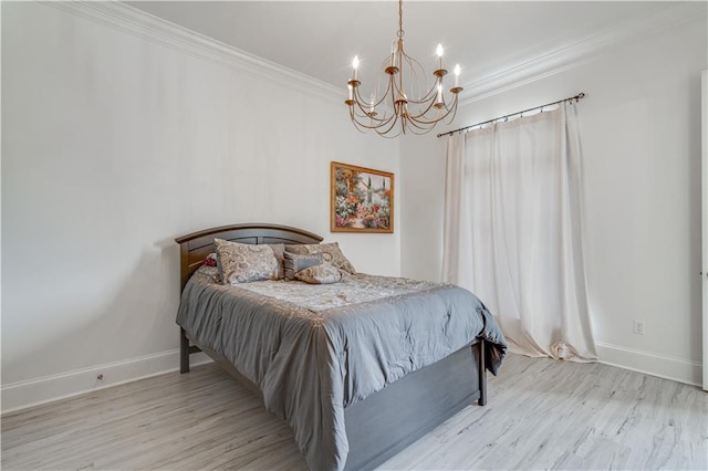 bedroom featuring a notable chandelier, crown molding, and light wood-type flooring