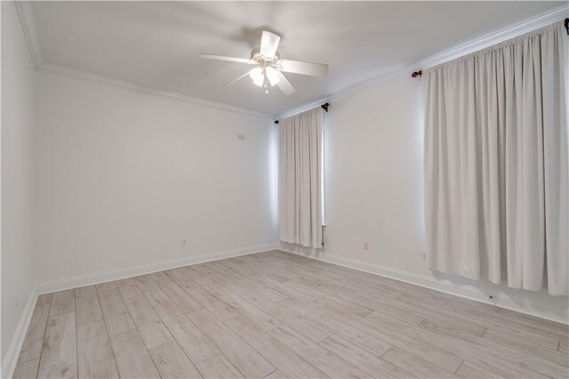 empty room featuring light hardwood / wood-style flooring, ceiling fan, and crown molding